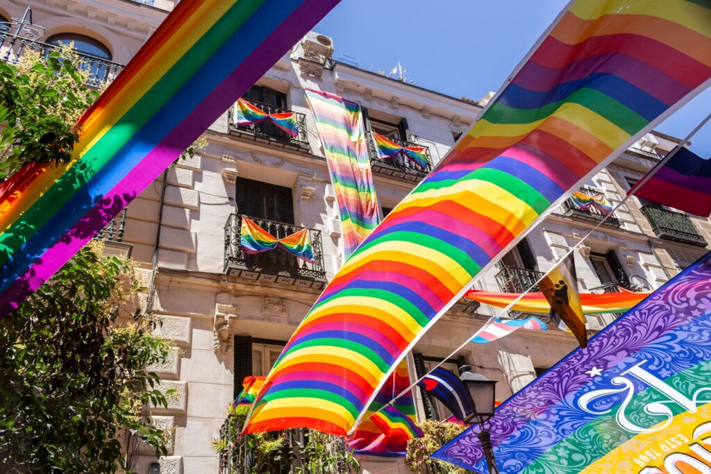 Rainbow flags fly off ornate balconies in Madrid for Pride