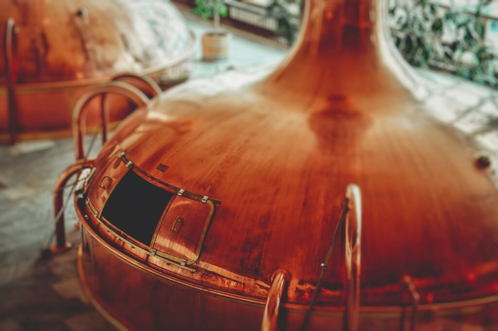 A huge, copper beer vat shaped like a flower bulb.