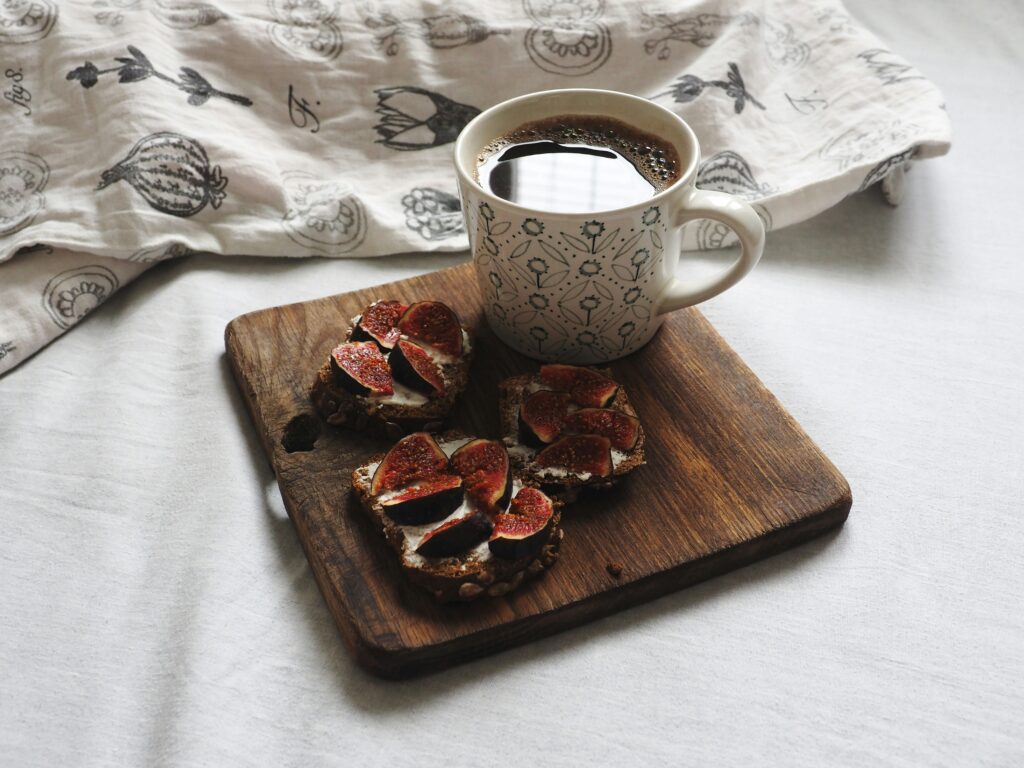 Scandinavian breakfast with rye bread and coffee in bed