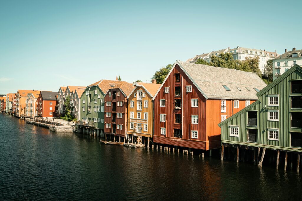 A river view of colorful houses in Trondheim, Norway