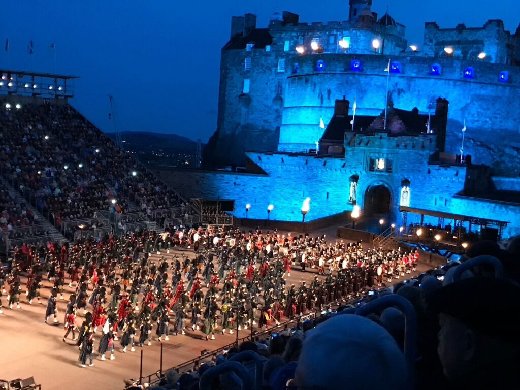 A performance of the Edinburgh Millitary Tattoo in front of Edinburgh Castle at night