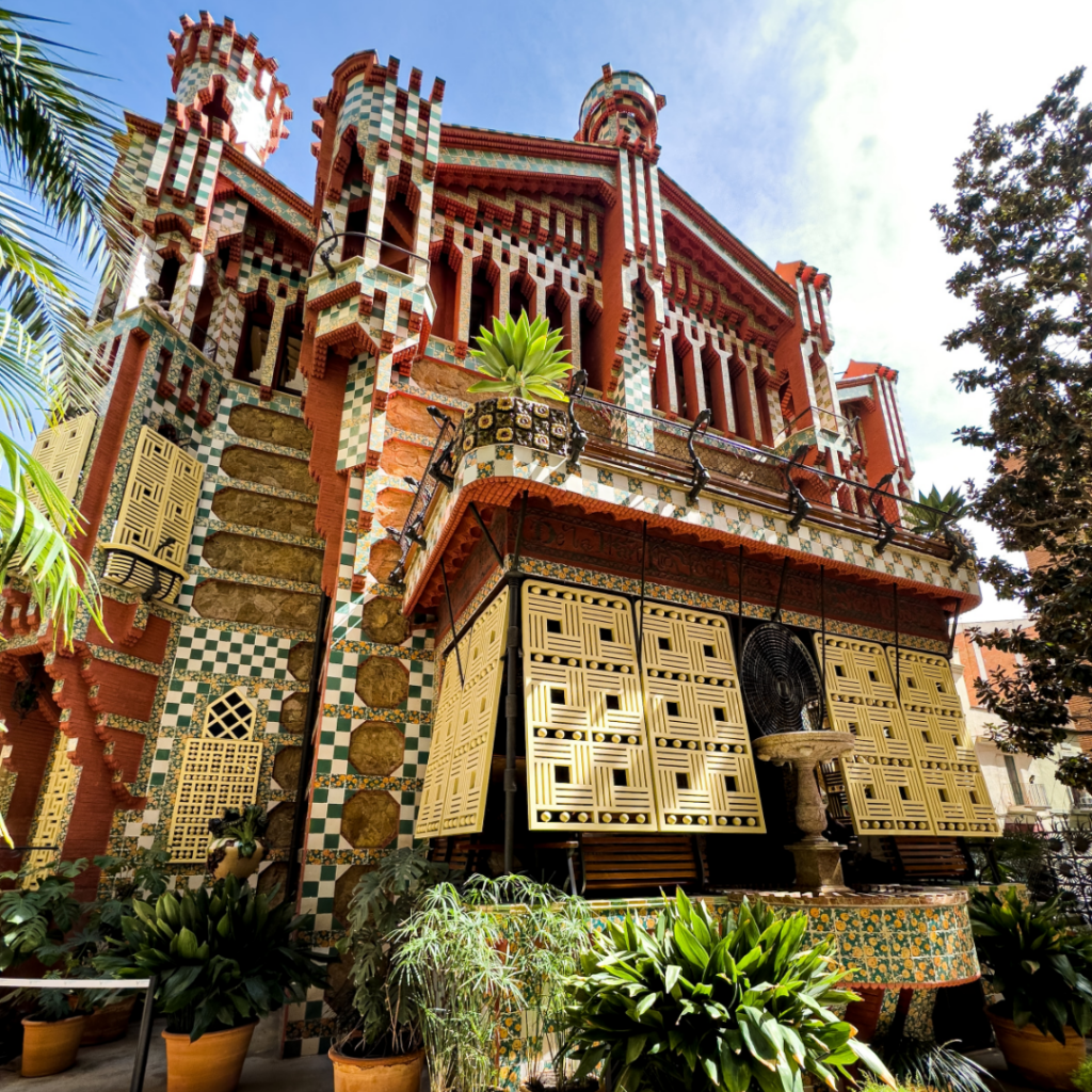 Ceramic tiles and red, yellow and brown colours cover the front of Casa Vicens, a famous Gaudi Barcelona landmark