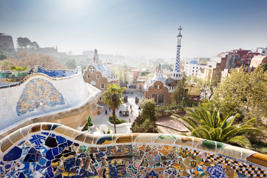 Colourful ceramic tiles decorate Gaudi’s Park Guell with views across Barcelona