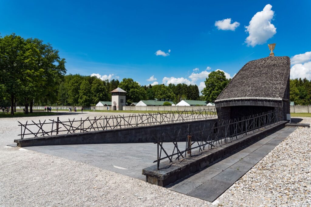 A feature of Dachau Concentration Camp is shown on a sunny day.