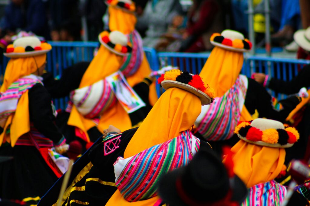 Colorful festival goers in Peru in traditional dress