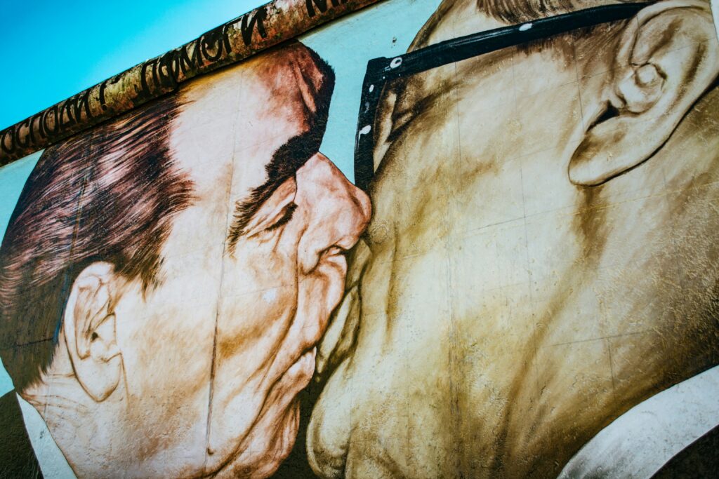 Dmitri Vrubel's "My God, Help Me to Survive This Deadly Love" depicts a kiss between Soviet leader Leonid Brezhnev and East German leader Erich Honecker