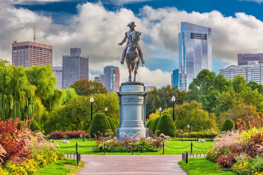 A park in Boston with Equestrian statue of George Washington standing in the middle