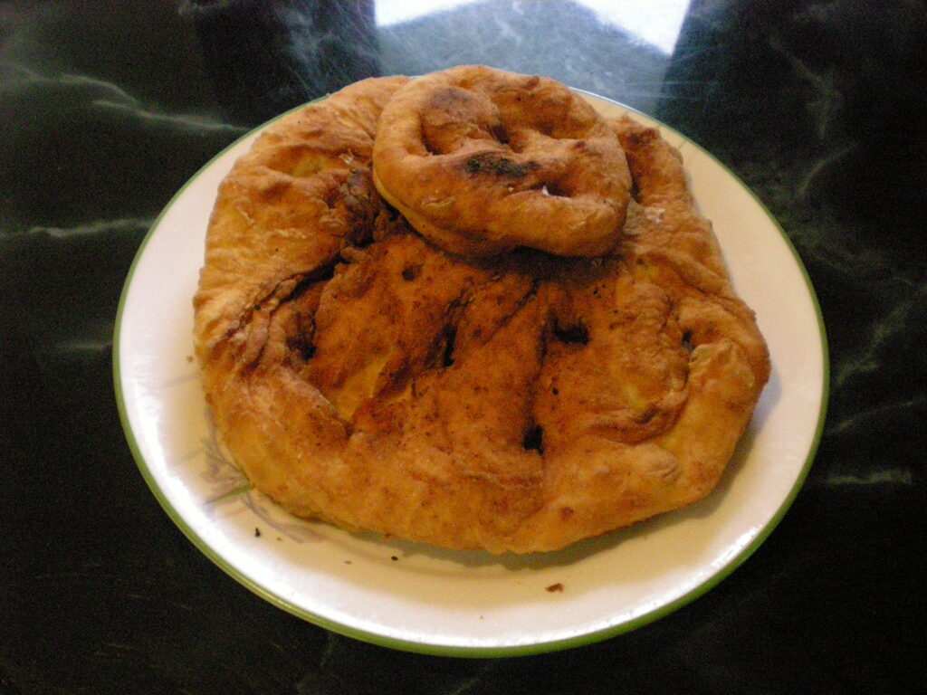 A close up of Bannock, a bread like Canadian food, on a plate.