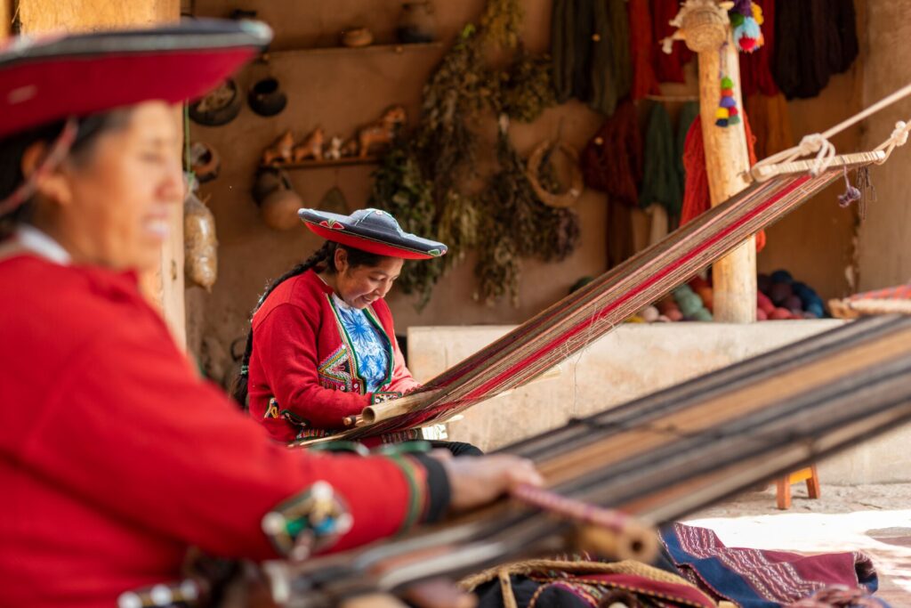 Women in a traditional Quechua weaving workshop in Cusco, Peru