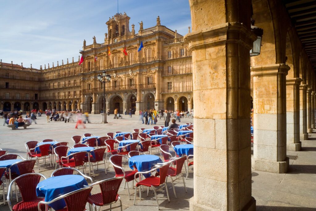 Salamanca's Plaza Mayor, with tables and chairs set up ready for dinner