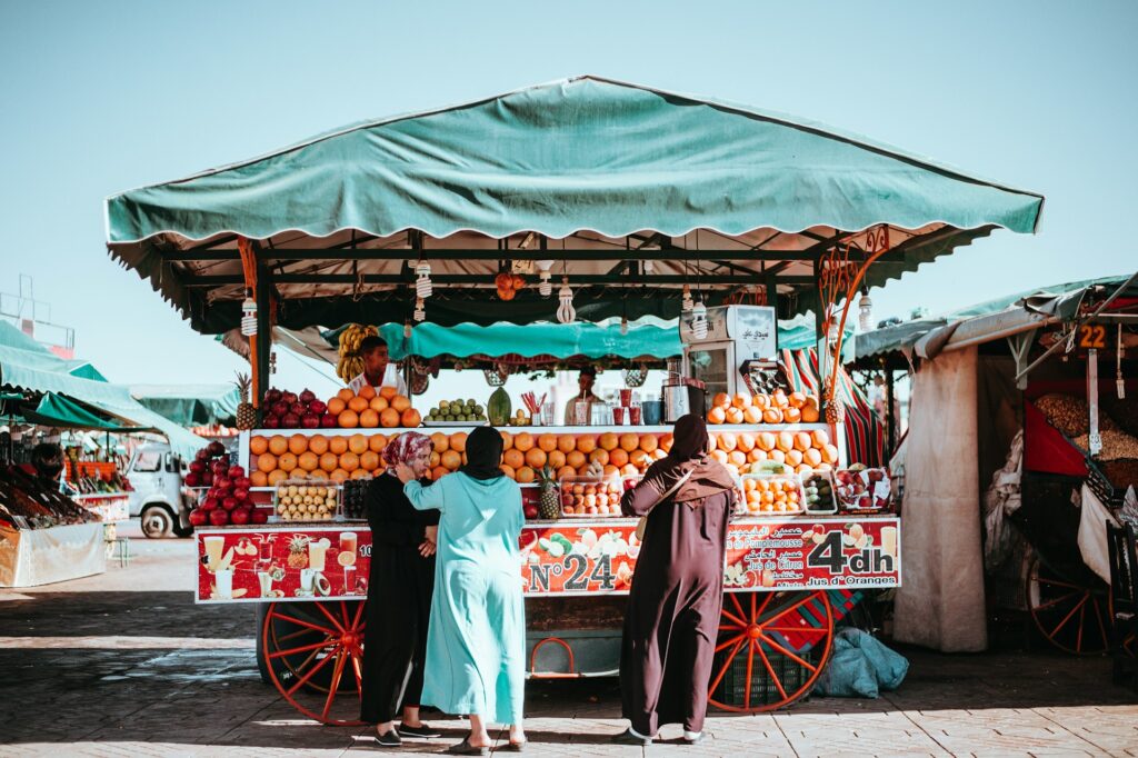 Women at a market stall in Morocco