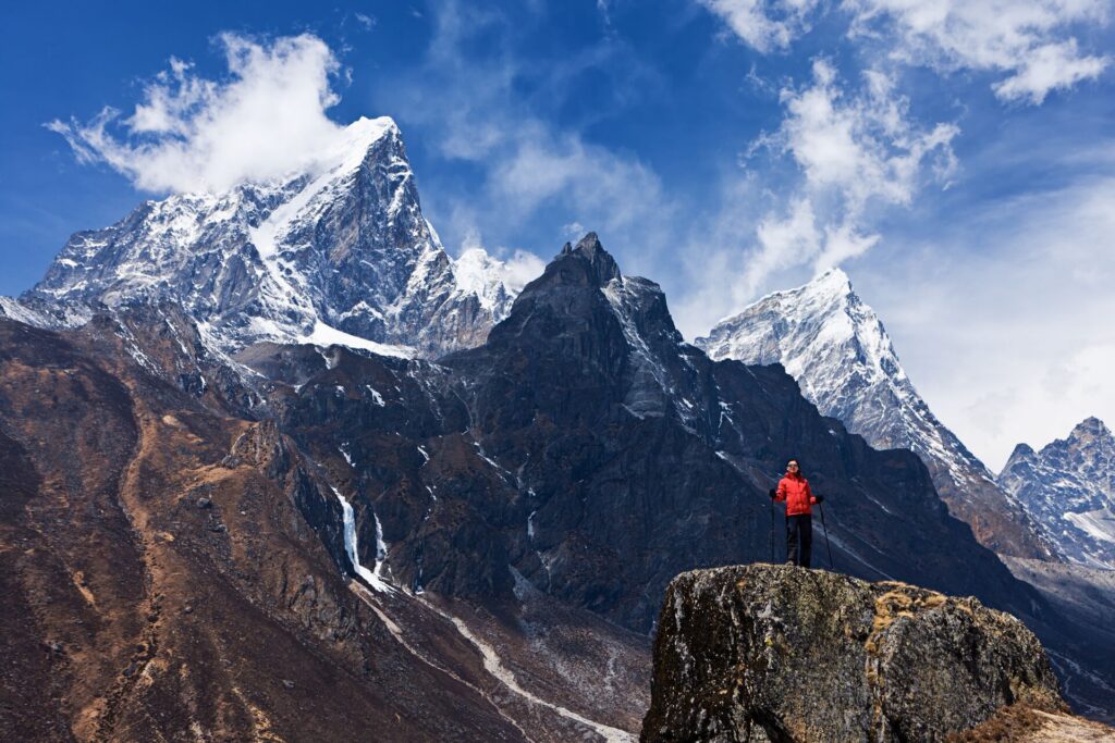 lone woman looking at himalayas mountains