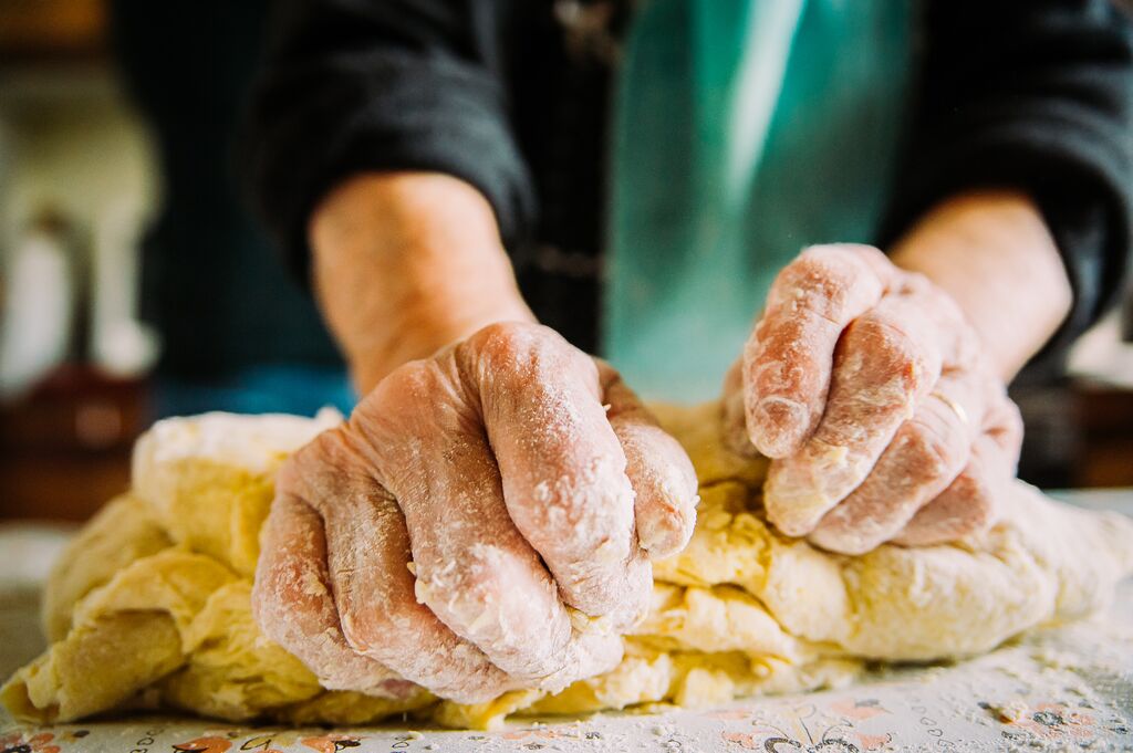 close up of hand making pasta