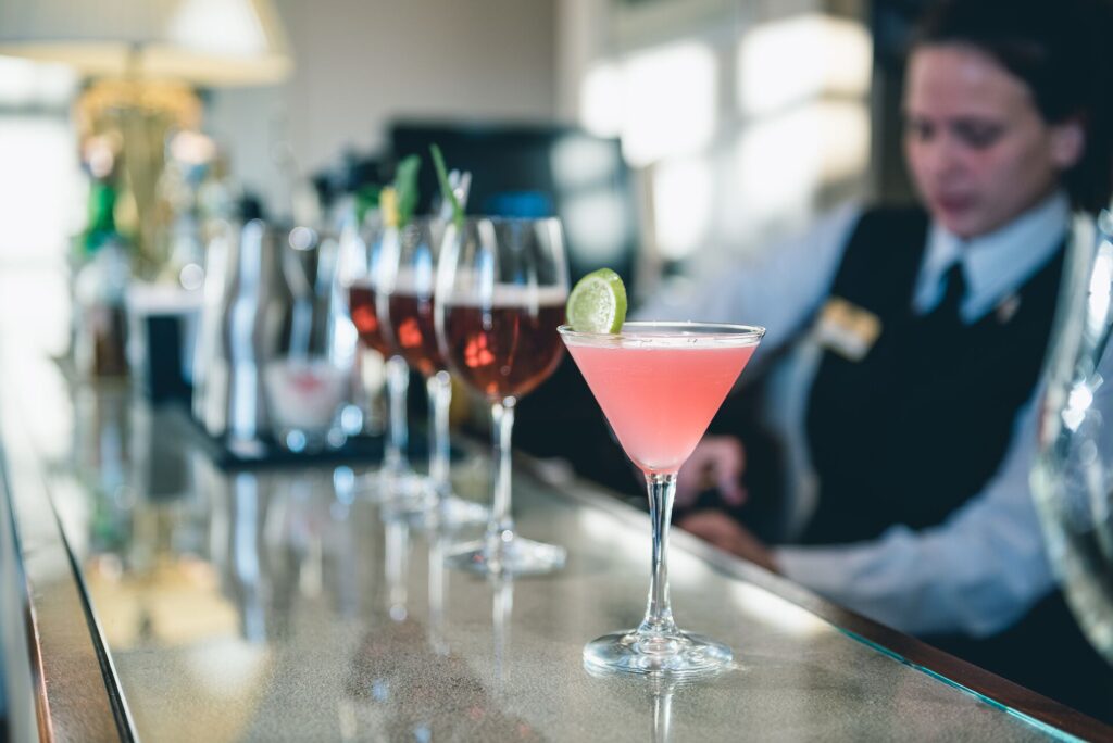 Cocktails being poured by a bartender