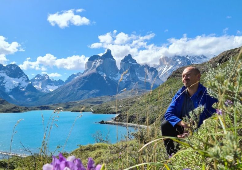 travel director paul in patagonia, mountains in background