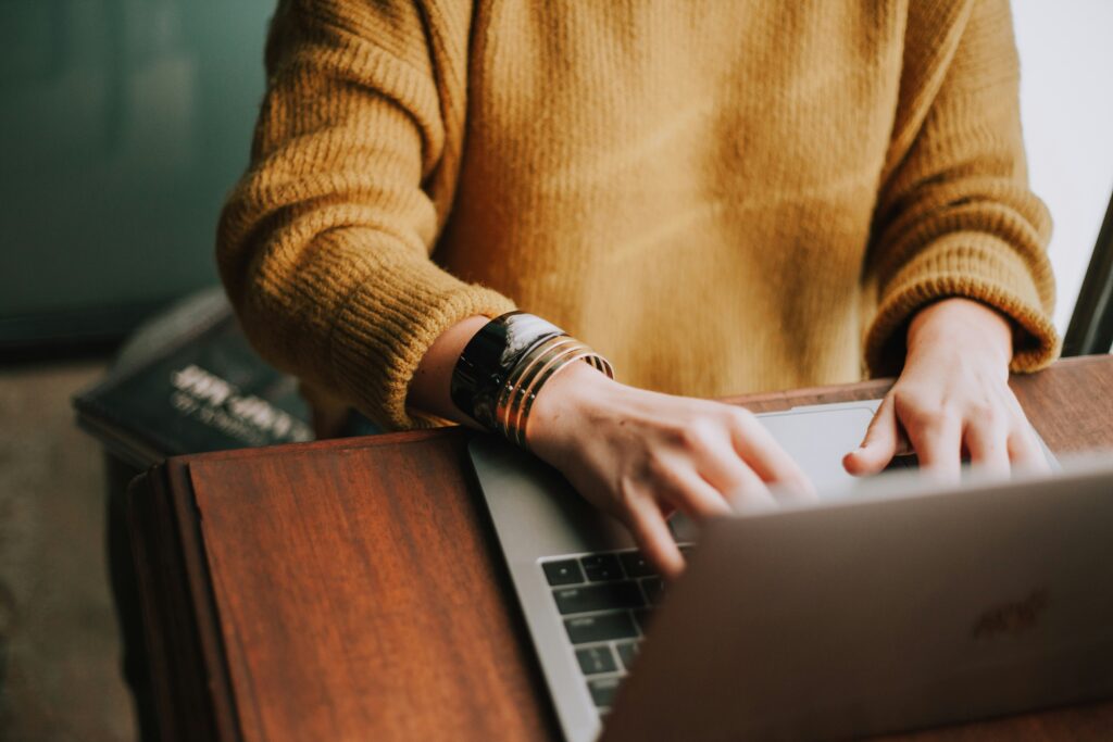 woman researching on laptop