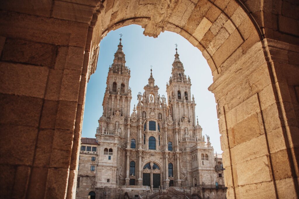 Santiago de Compostela Cathedral in Spain seen through a brick alcove