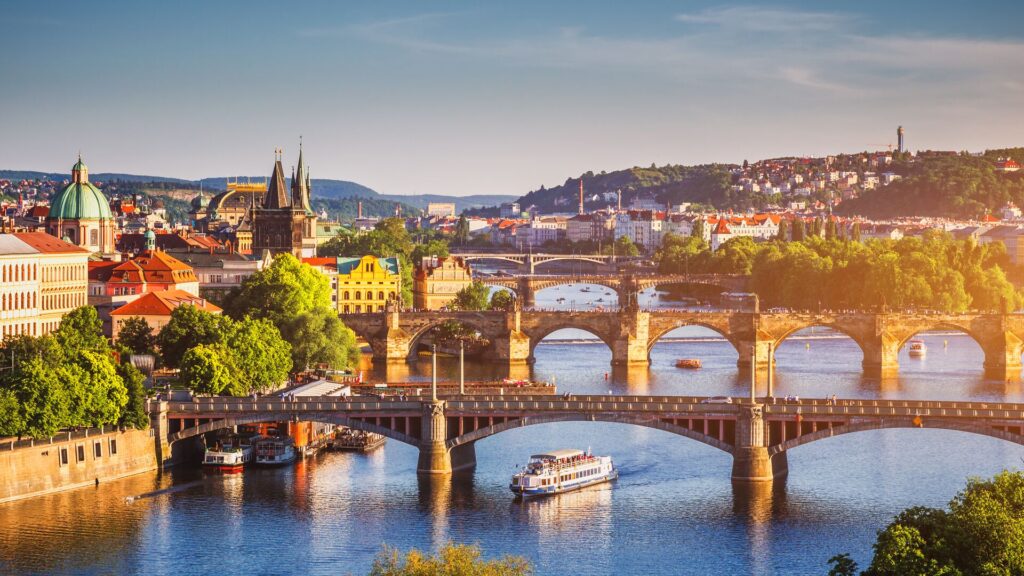 Scenic spring sunset aerial view of the Old Town pier architecture and Charles Bridge over Vltava river in Prague, Czech Republic