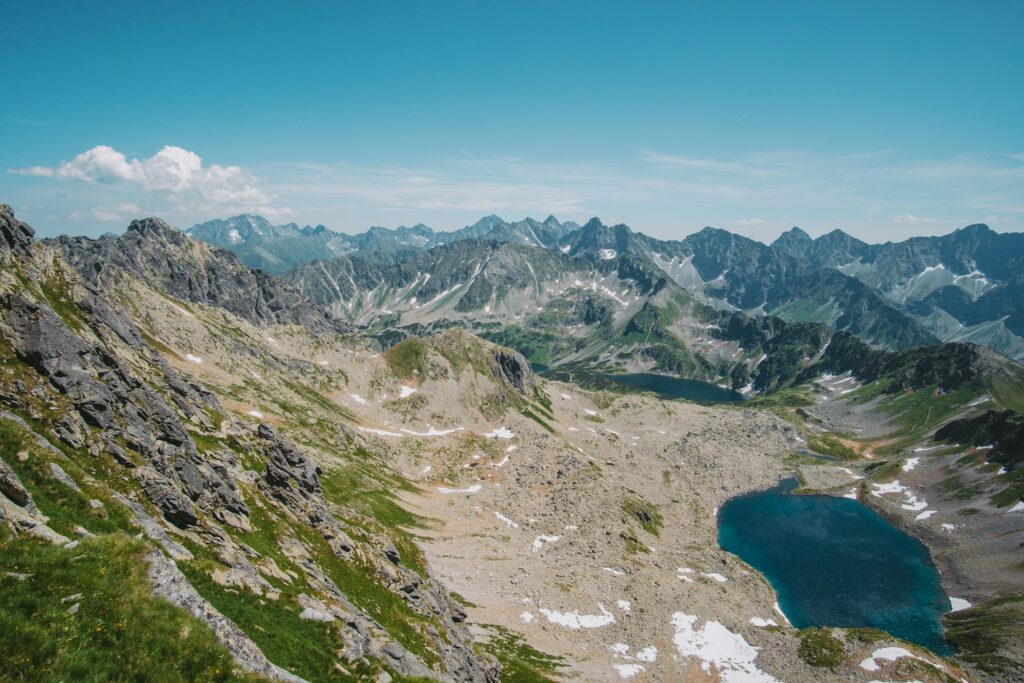 Small blue lake surrounded by rocky mountains, Poland