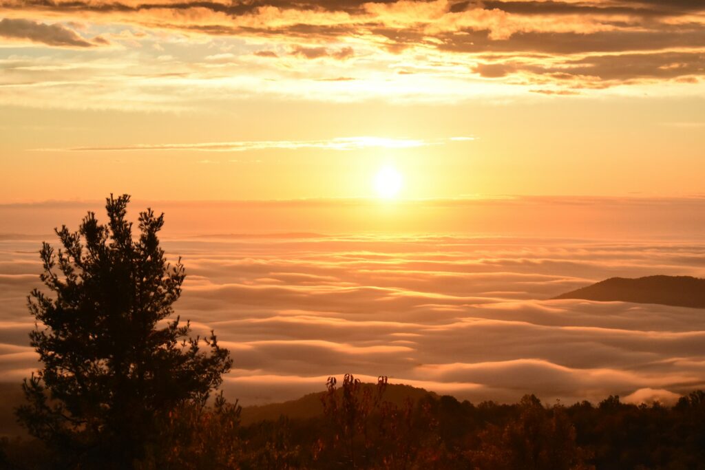 Sunset over low clouds seen from top of a mountain in Shenandoah National Park 