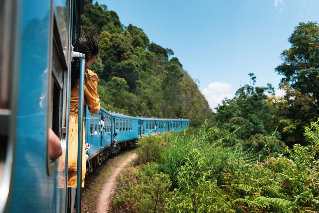 woman riding train in sri lanka