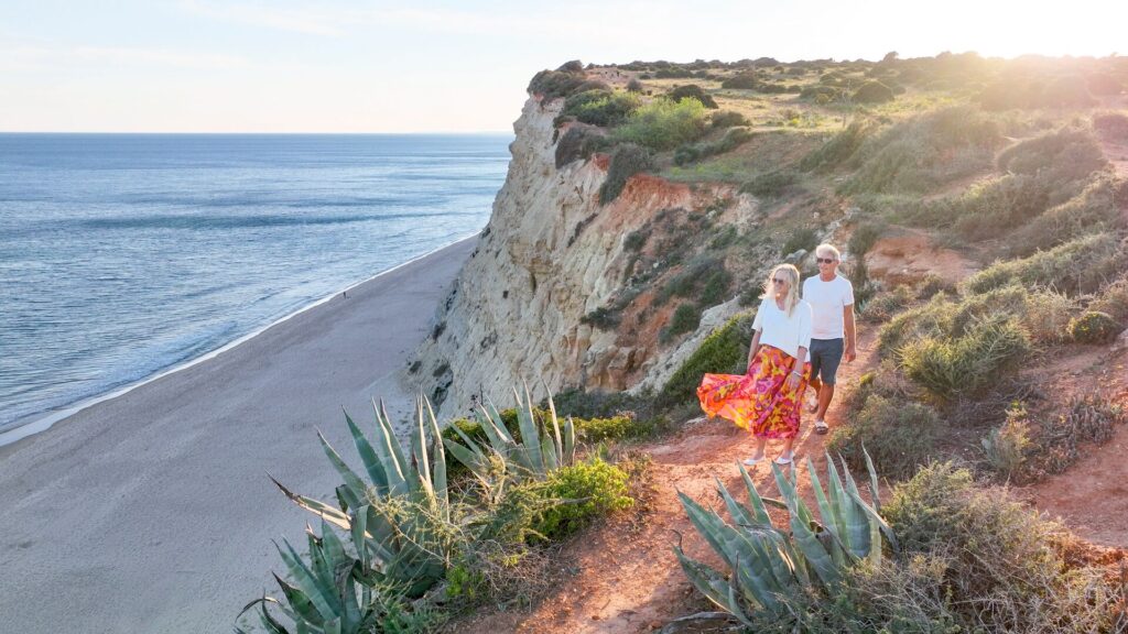 Older couple on cliffside in Portugal